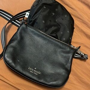 Gently used Kate Spade crossbody with black and white adjustable strap